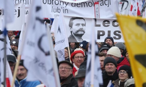 A portrait of Lech Wałęsa on one of the banners held by pro-democracy protesters on in Warsaw 27 February.