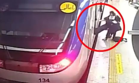 Footage of the incident showing a girl being carried off a train by other girls at a metro station