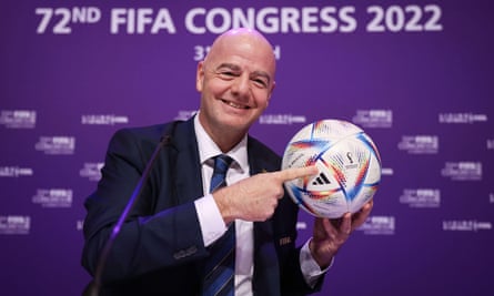 Fifa President Gianni Infantino holds the official 2022 World Cup match ball, called “Al Rihla”.