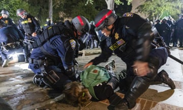 Pro-Palestinian demonstration at UCLA in Los Angeles<br>LOS ANGELES, CALIFORNIA - MAY 2: US Police arrests a Pro-Palestinian demonstrator as the people protest at UCLA, in Los Angeles, California, USA on May 2, 2024. (Photo by Grace Yoon/Anadolu via Getty Images)