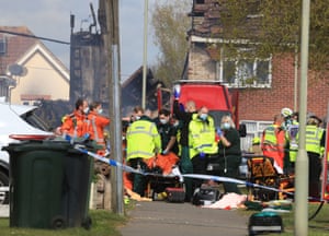 Willesborough, UKParamedics and emergency services attend to an injured person at the scene of a house fire in Mill View near Ashford in Kent following a reported explosion
