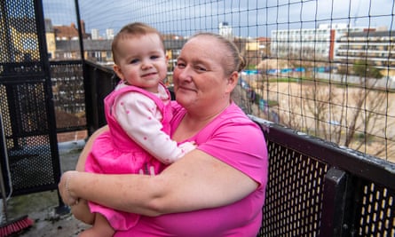 Maryanne Vanson with her daughter on the balcony of her flat