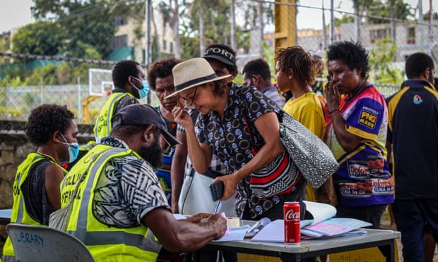 Moresby North-East candidate Tania Bale begins the process to cast her vote at the Gordons International School in Port Moresby