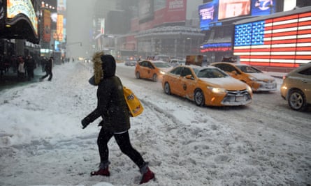 Pedestrians struggle through snow in downtown Manhattan.