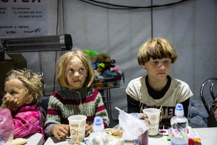 Children in a food tent in Zaporizhzhia catering for evacuees from Mariupol, 8 May 2022.