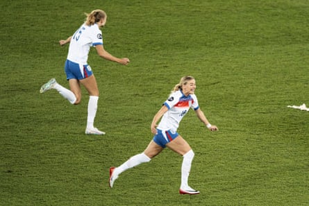 Esme Morgan and her fellow substitute Chloe Kelly take off after England’s shootout win.