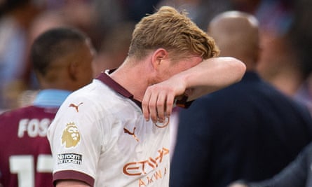 Kevin De Bruyne leaves the field with a hamstring injury during City’s first league game of the season at Burnley.