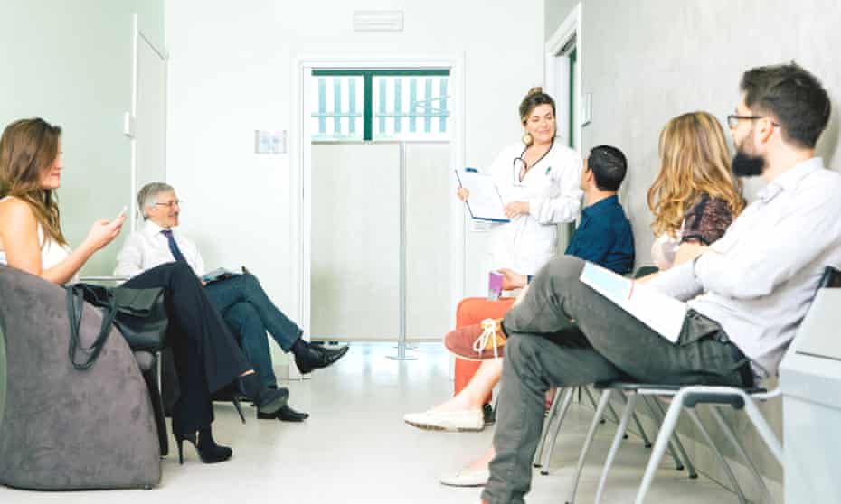 Waiting Room, Mature Female Doctor Talking To A PatientPosed by models Five people are sitting in the waiting room of a doctor's office. Some of the people look tense or upset, and others look completely relaxed.