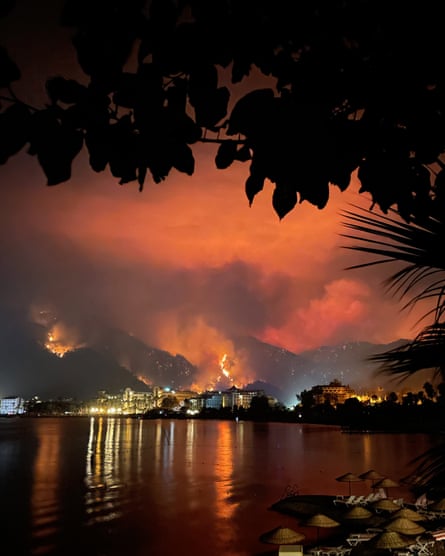 A wildfire in the hills behind Icmeler Bay, in Muğla province.