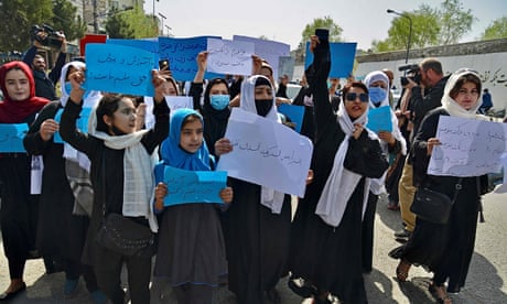 Afghan women and girls take part in a protest in front of the Ministry of Education in Kabul.