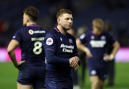 Finn Russell and his teammates look on dejected after the full time whistle.
