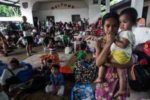 Villagers take shelter at a school