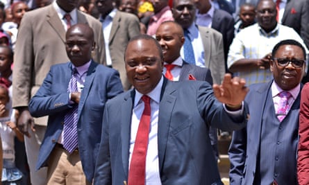 Uhuru Kenyatta greets the crowd after attending church.