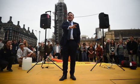 Jon Ashworth speaks during a Extinction Rebellion protest at Parliament Square in London