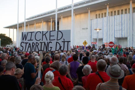 Thousands of demonstrators gather outside the John F. Kennedy Center for the Performing Arts in Washington