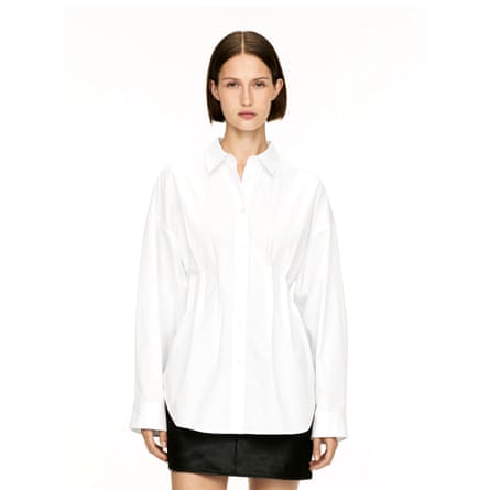 A model wears an Arket pleated blouse in white