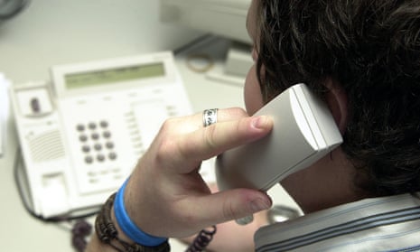 person making a phone call from a landline