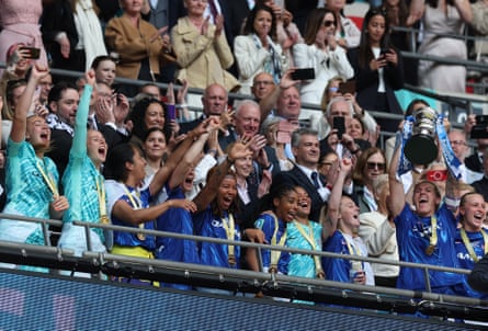 Millie Bright lifts the FA Cup after Chelsea’s win against Manchester United.