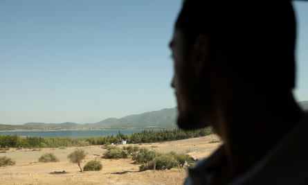 Ahmed silhouette against Greek countryside