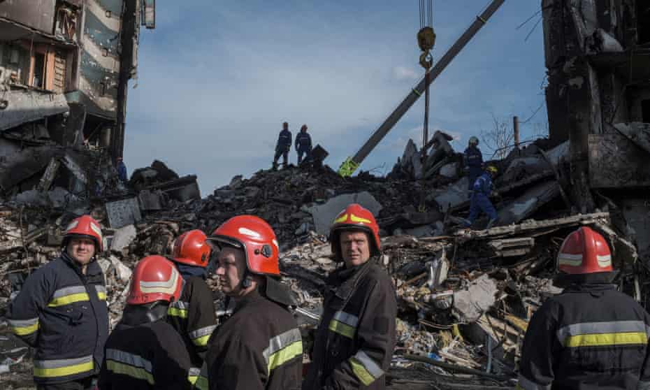 Firefighters work at the site of buildings that were destroyed by shelling in Borodianka as part of Russia's invasion of Ukraine.