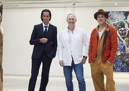 British artist Thomas Houseago (centre) posing with US actor Brad Pitt (right) and Australian musician Nick Cave prior to the opening of their exhibition at the Sara Hilden Art Museum in Tampere, Finland.
