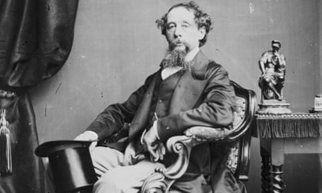 Charles Dickens formally posed, seated in an armchair  holding his top hat