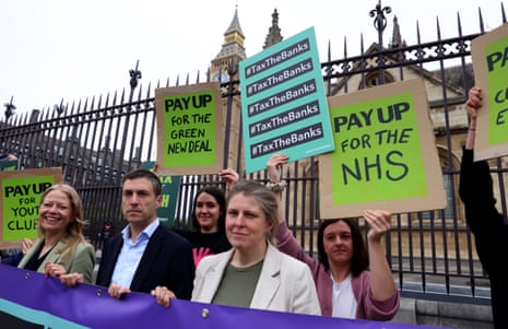 Siân Berry, Adrian Ramsay and Ellie Chowns, with Green party colleagues, outside parliment this morning.