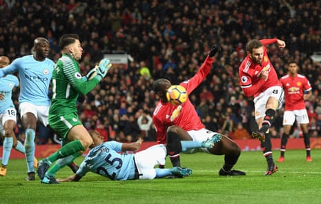 Ederson makes a bouble save from Mata after saving the shot from Lukaku.