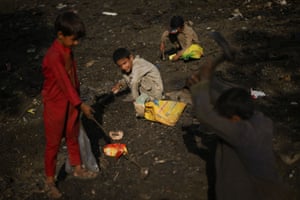 Children scavenge for scrap metal in Kabul