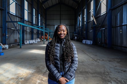 Tshepang Matela stands in a big industrial hall.