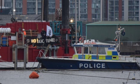 Police arrive at the scene of the Extinction Rebellion protest on the Thames early on Saturday morning.
