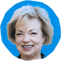 woman smiling against blue background