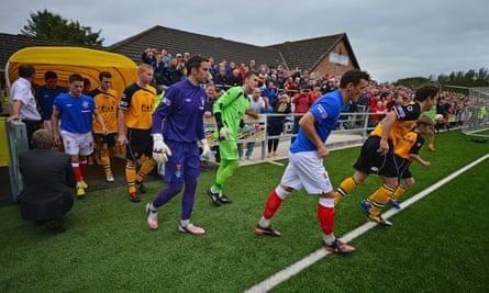 Annan Athletic and Rangers players make their way on to the pitch for the Scottish Third Division match at Galabank Stadium in September 2012
