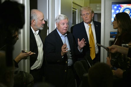 a man speaks to a crowd of people in a plane