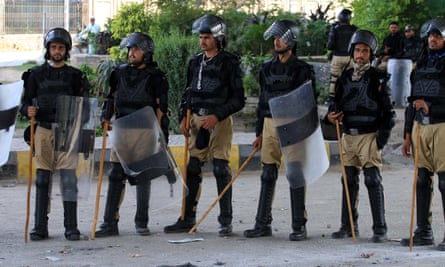 Riot police take up position on the third day after the arrest of Imran Khan