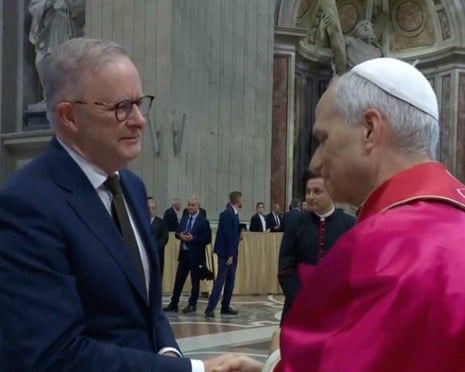 Screengrab of Albanese and Pope Leo shaking hands.