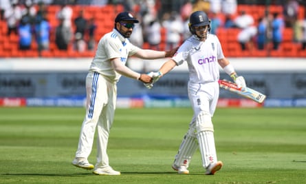 The India captain, Rohit Sharma, congratulates Ollie Pope of England (right)