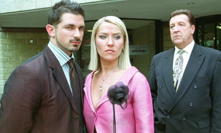 John Forgeham, right, as Frank Laslett, the wheeler-dealer chairman of Earls Park FC in Footballers Wives, with Zöe Lucker, centre, and Cristian Solimeno.