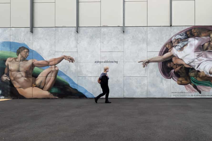 Woman in front of a mural in St Kilda