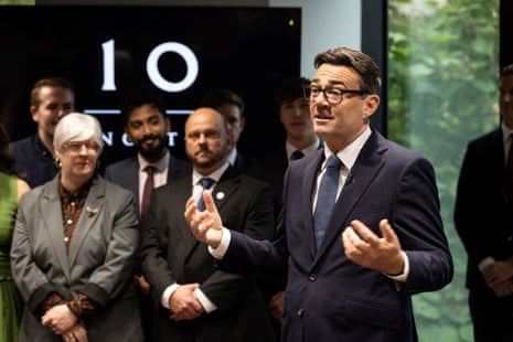 Andy Burnham speaking to staff standing around him at No 10 North.
