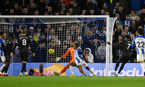 Arsenal's Bukayo Saka scores their first goal.