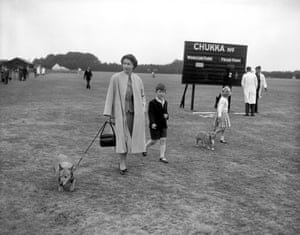 1956: The Queen strolls through Windsor Great Park with Prince Charles, Princess Anne, and two of her corgis