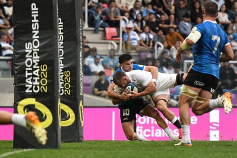 Ben Earl of England dives to score his team’s second try as he is tackled by Tomas Albornoz of Argentina.