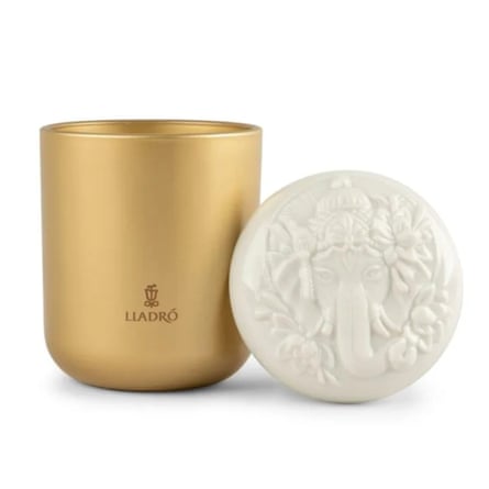 Lladró Lord Ganesha candle. The jar is gold and next to it is the engraved porcelain lid.