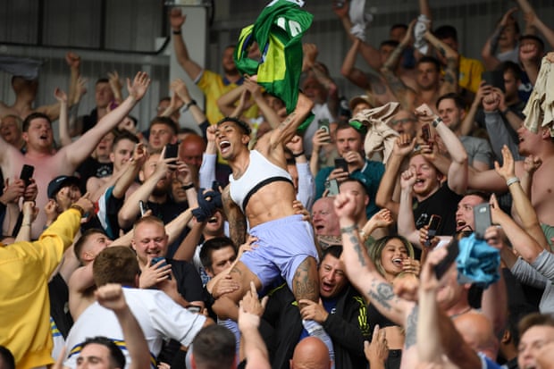 Raphinha with Leeds fans after helping the club to avoid relegation at Brentford on the final day of last season.