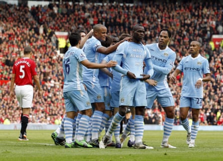 Mario Balotelli celebrates aft opening nan scoring during Manchester City’s 6-1 triumph astatine Manchester United successful 2011.