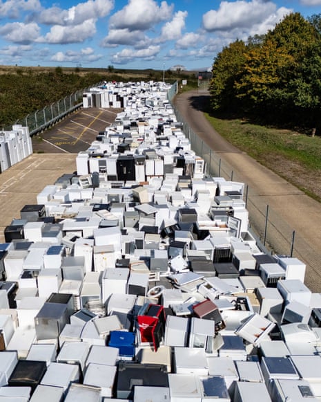 Rows of discarded fridges and freezers stretch into the distance