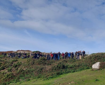 Birdwatchers gather at Ramsey Island nature reserve, in Pembrokeshire, to see the rare birds.