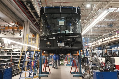 Workers build electric buses at the Solaris bus factory in Poznan, Poland
