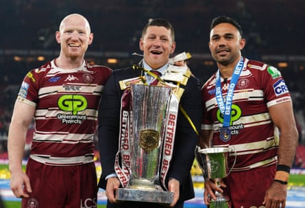 Wigan's Liam Farrell (left), head coach Matt Peet and Bevan French celebrate with the trophy after the 2024 Super League Grand Final